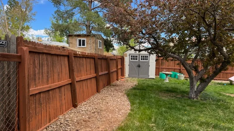 Restored and stained wood privacy fence