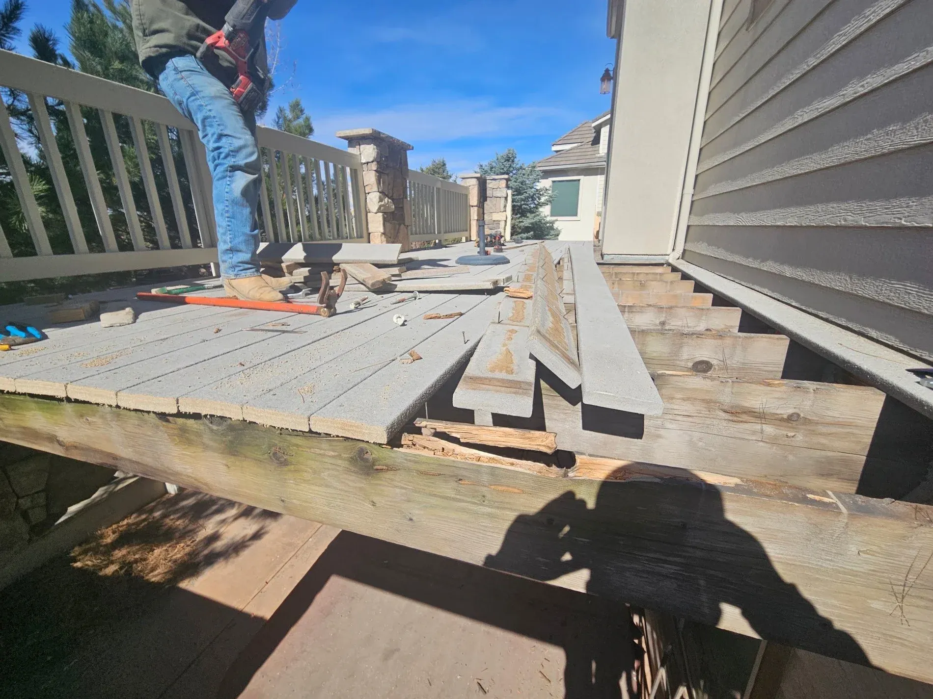 Old deck removed before structural rebuild